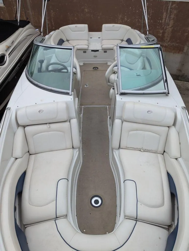 Slide: The Image of 2009 Crownline 240 LS boat with spacious seating and dual windshields. - 9