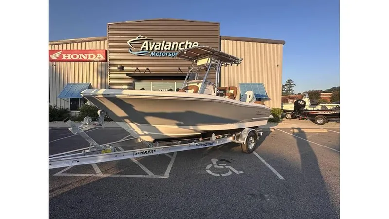 The Image of 2025 Pioneer 202 Islander boat on trailer outside Avalanche Motorsports dealership. - 0