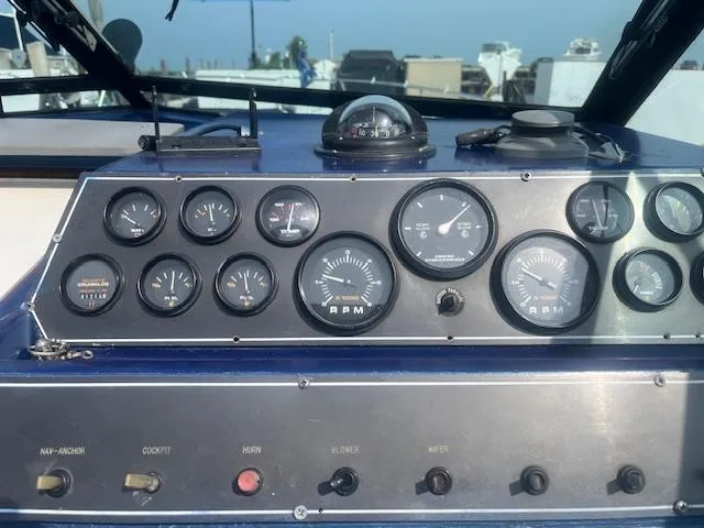 Slide: The Image of Dashboard of a 1988 Regal 277 Commodore XL boat with gauges and controls. - 14