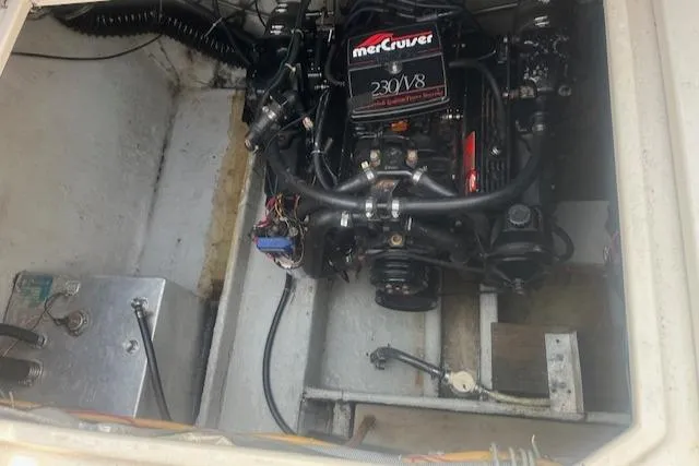 Slide: The Image of 1988 Regal 277 Commodore XL engine compartment with MerCruiser 230 V8 engine. - 25