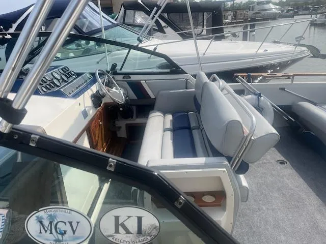 Slide: The Image of 1988 Regal 277 Commodore XL boat interior with steering wheel and seating. - 6