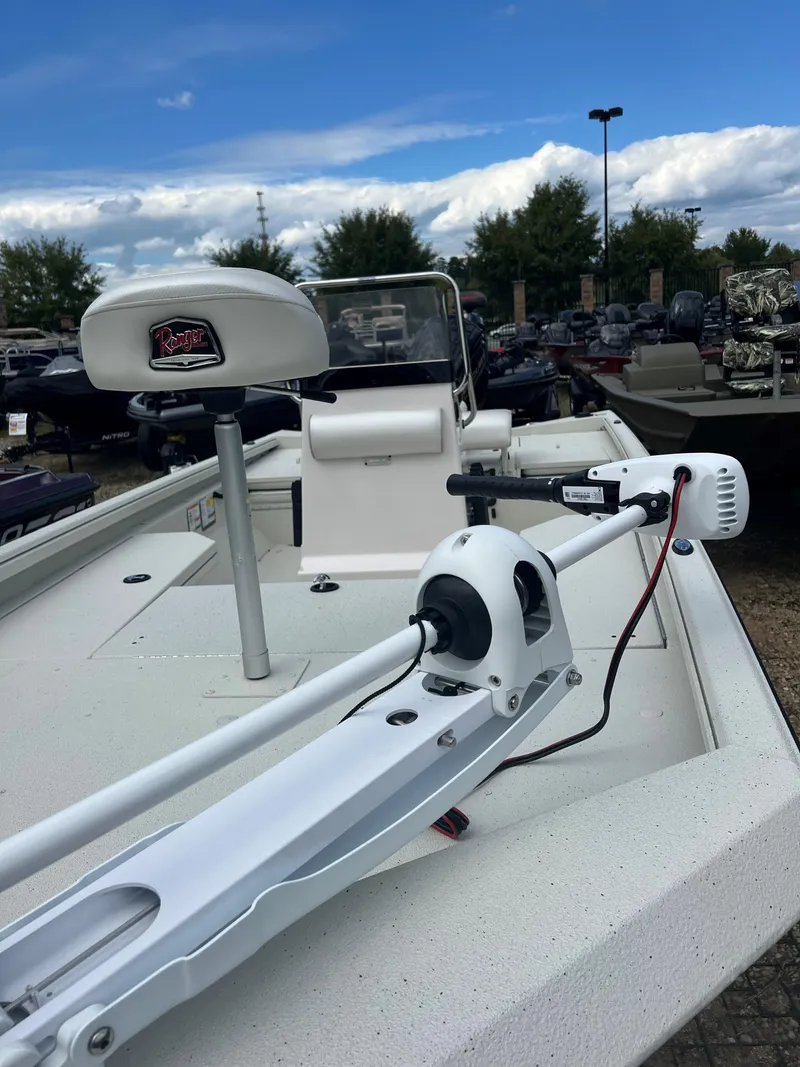 Slide: The Image of 2024 Ranger RB190 boat with trolling motor and seat, displayed outdoors. - 6