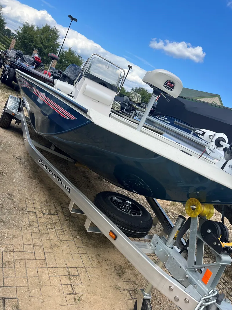 Slide: The Image of 2024 Ranger RB190 boat on trailer under blue sky. - 8