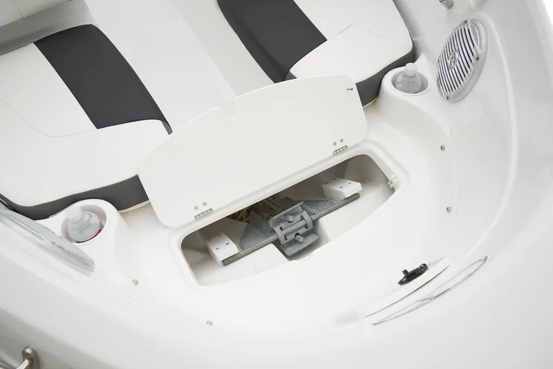 Slide: The Image of 2024 Tahoe 200 S boat interior with blue and white cushioned seating. - 9