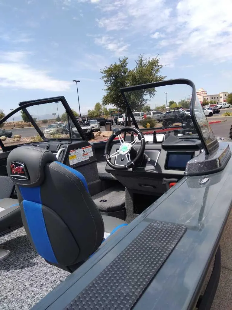 Slide: The Image of 2024 Ranger VX1988 WT boat interior with steering wheel and seating. - 5