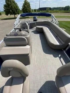 Slide: The Image of 2024 Ranger Reata 200F pontoon boat with spacious seating and modern design. - 7