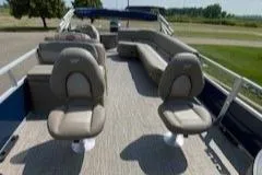 Slide: The Image of 2024 Ranger Reata 200F boat interior with seating and open deck. - 10