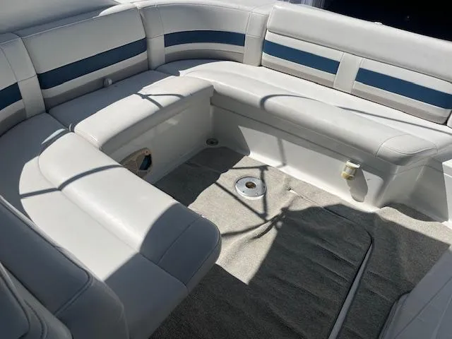 Slide: The Image of 1999 Formula 280 Bowrider interior seating with white and blue upholstery. - 4