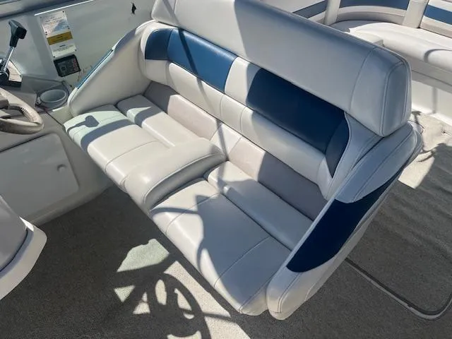 Slide: The Image of 1999 Formula 280 Bowrider interior seating with blue and white upholstery. - 7