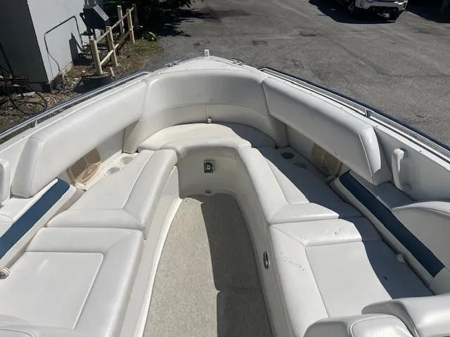 Slide: The Image of 1999 Formula 280 Bowrider boat interior with white seating and spacious layout. - 8