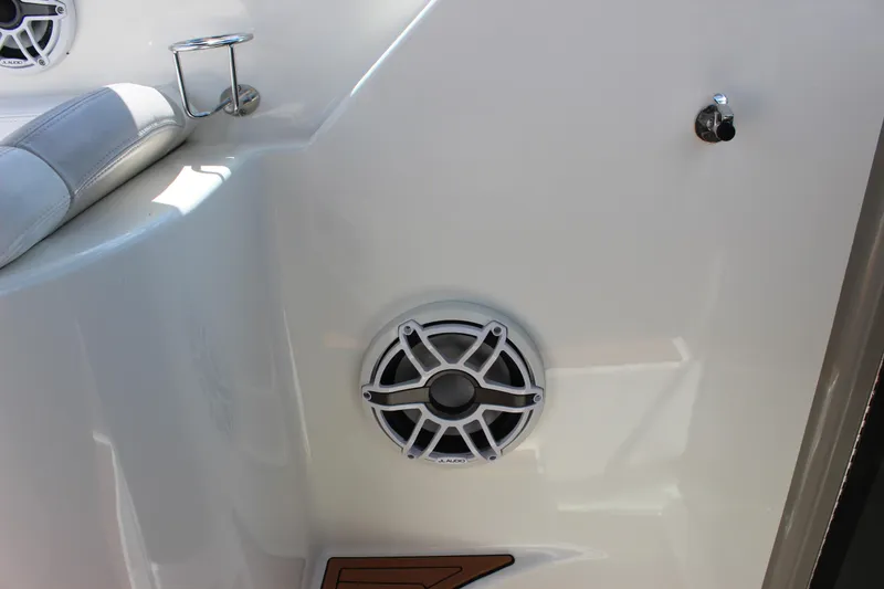 Slide: The Image of 2012 Sea Ray 280 Sundancer boat interior with speaker and seating detail. - 11
