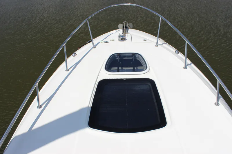 Slide: The Image of Bow view of 2012 Sea Ray 280 Sundancer, featuring sleek design and railing. - 16