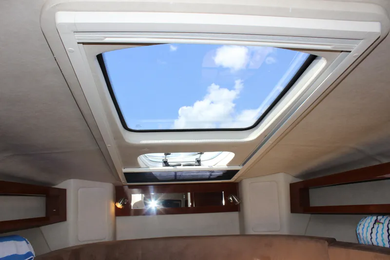 Slide: The Image of Interior view of 2012 Sea Ray 280 Sundancer cabin with skylight. - 32