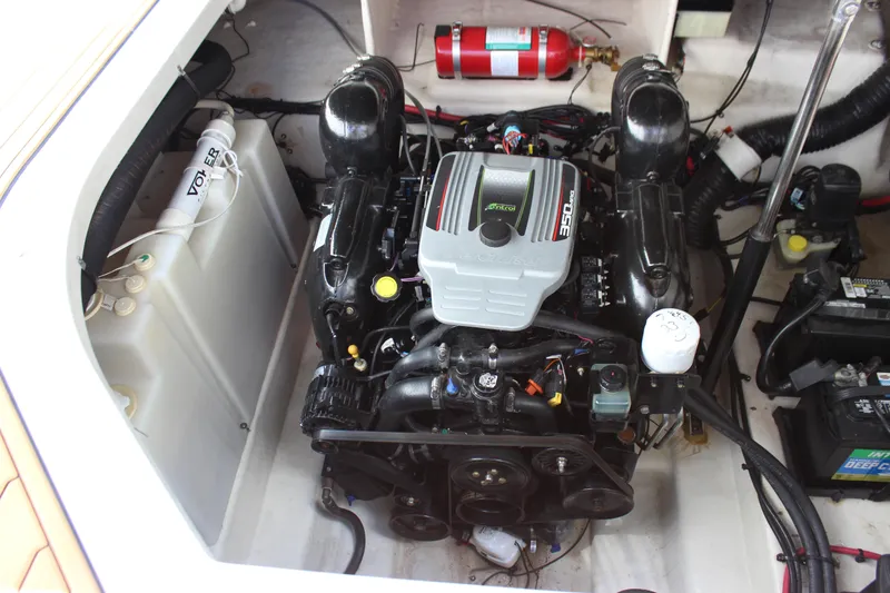 Slide: The Image of Engine compartment of a 2012 Sea Ray 280 Sundancer boat, featuring a MerCruiser engine. - 37