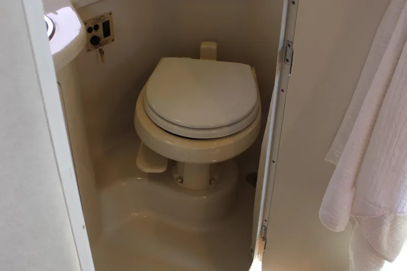 Slide: The Image of Boat bathroom with toilet in 2012 Sea Ray 280 Sundancer. - 46