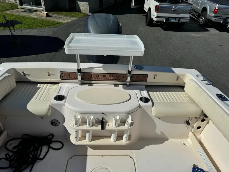 Slide: The Image of 2009 Grady-White 228 Seafarer boat interior with seating and fishing rod holders. - 10