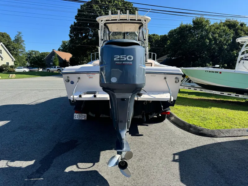 Slide: The Image of 2009 Grady-White 228 Seafarer boat with 250 horsepower outboard motor, parked outdoors. - 3