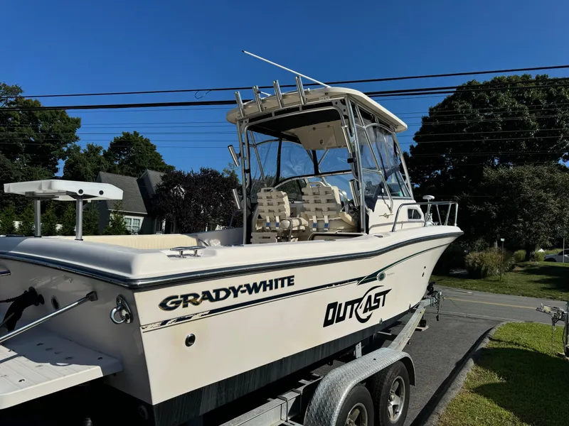 Slide: The Image of 2009 Grady-White 228 Seafarer boat on trailer, sunny day, residential background. - 4