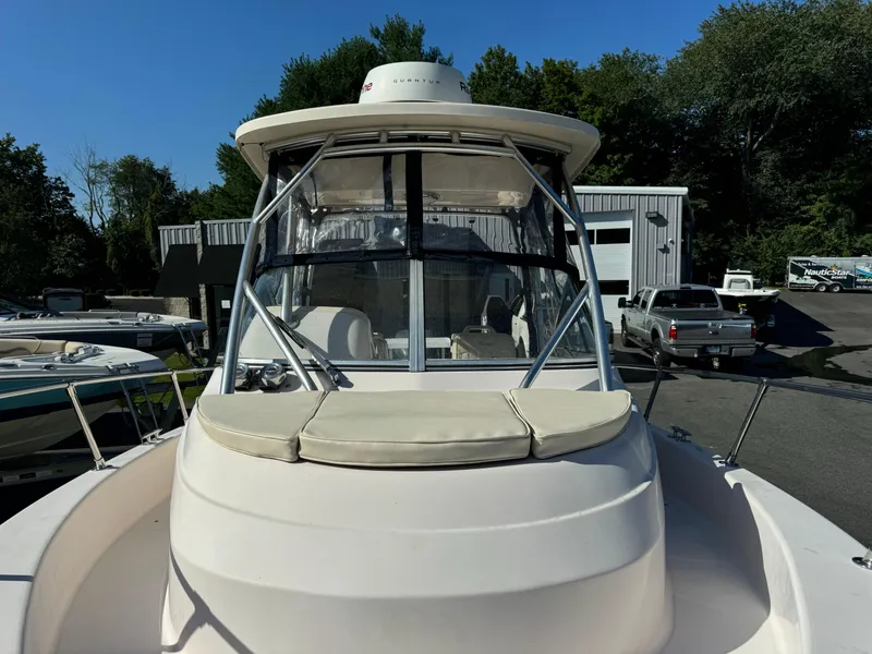Slide: The Image of 2009 Grady-White 228 Seafarer boat, front view, docked outdoors. - 8