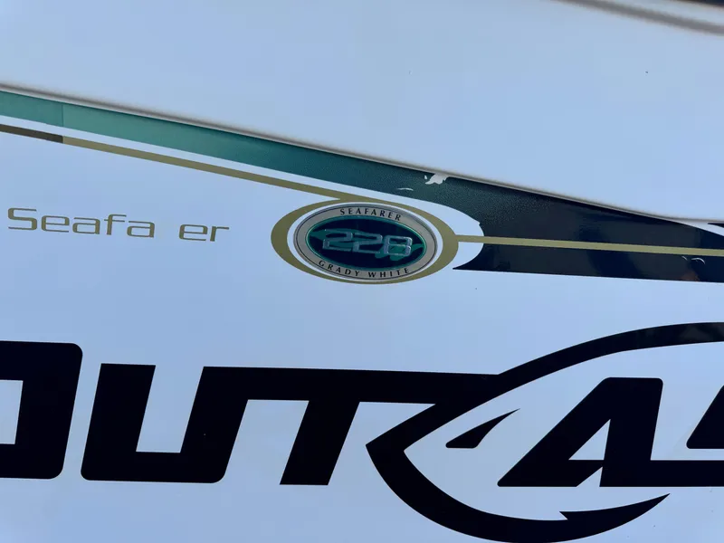 Slide: The Image of Close-up of 2009 Grady-White 228 SEAFARER boat logo and partial text. - 9