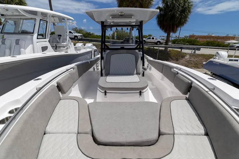 Slide: The Image of 2024 Sea Fox 288 Commander boat interior with cushioned seating and sleek design. - 17