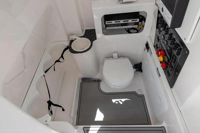 Slide: The Image of 2024 Sea Fox 288 Commander boat interior with toilet and control panel. - 22