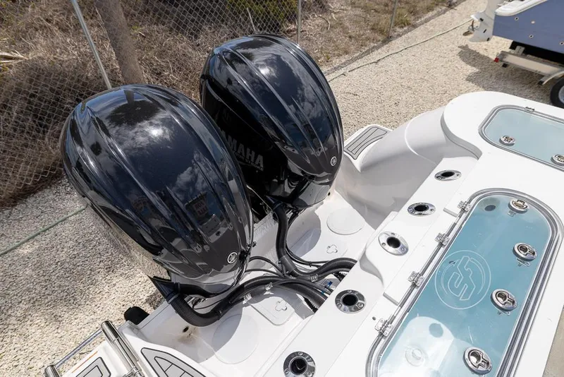 Slide: The Image of 2024 Sea Fox 288 Commander with dual Yamaha outboard engines, rear view. - 4