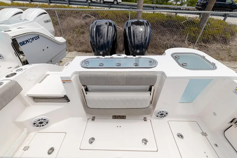 Slide: The Image of 2024 Sea Fox 288 Commander boat deck with dual engines and seating area. - 5