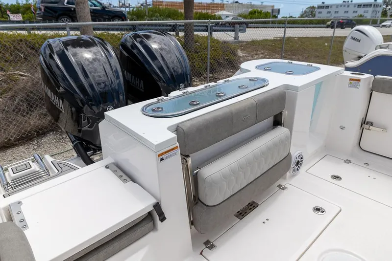 Slide: The Image of 2024 Sea Fox 288 Commander boat with dual Yamaha engines and spacious seating area. - 6