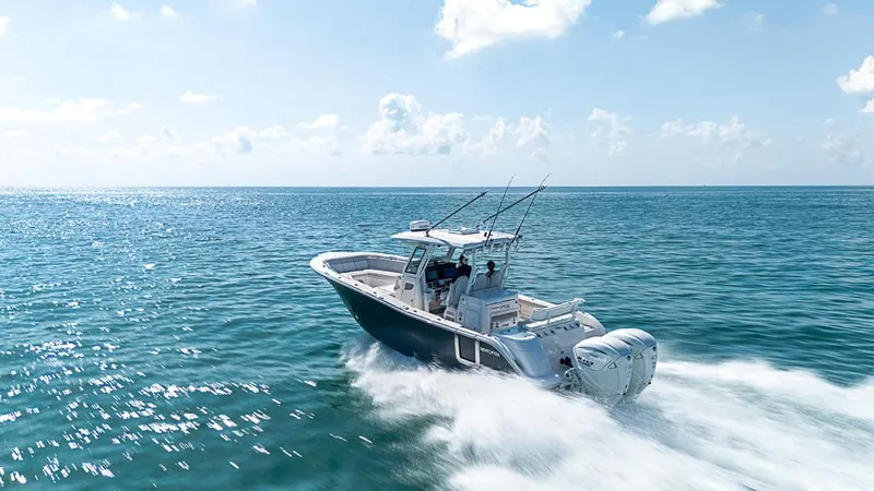 Slide: The Image of 2024 Sea Fox 328 Commander cruising on open ocean under clear skies. - 1