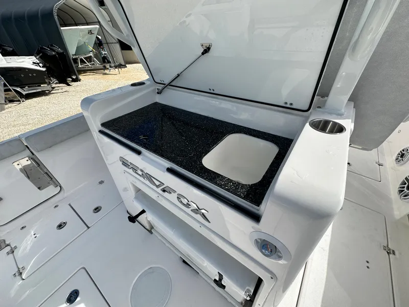 Slide: The Image of 2024 Sea Fox 328 Commander boat interior with open storage compartment. - 22