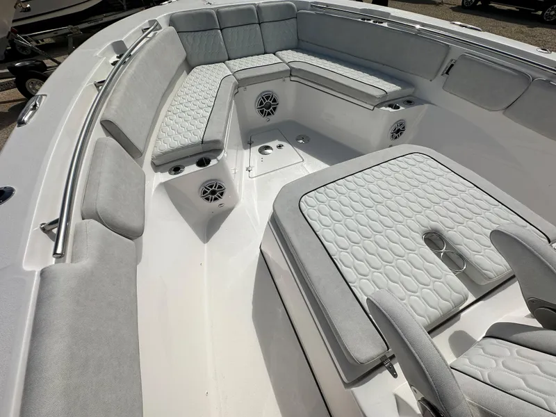Slide: The Image of 2024 Sea Fox 328 Commander boat interior with cushioned seating and speakers. - 23