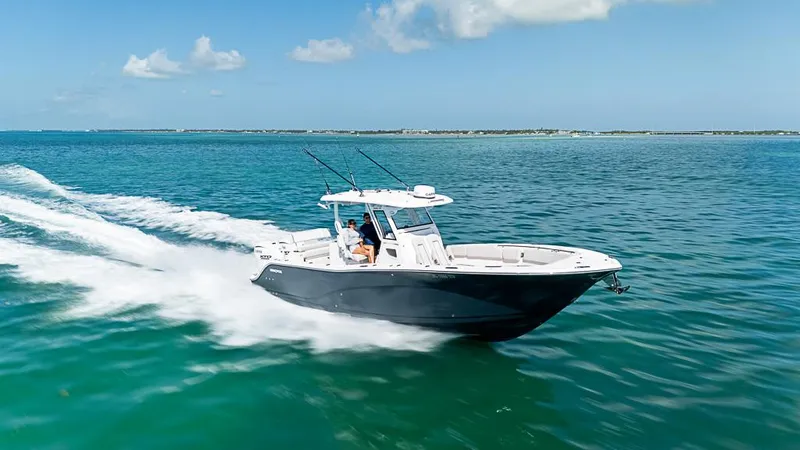 Slide: The Image of 2024 Sea Fox 328 Commander cruising on open water under clear skies. - 7