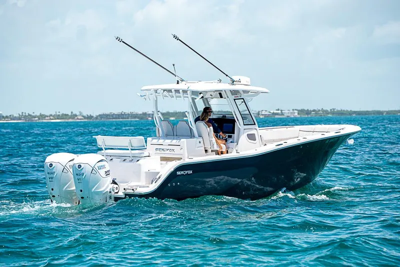 Slide: The Image of 2024 Sea Fox 328 Commander boat cruising on blue ocean waters. - 8