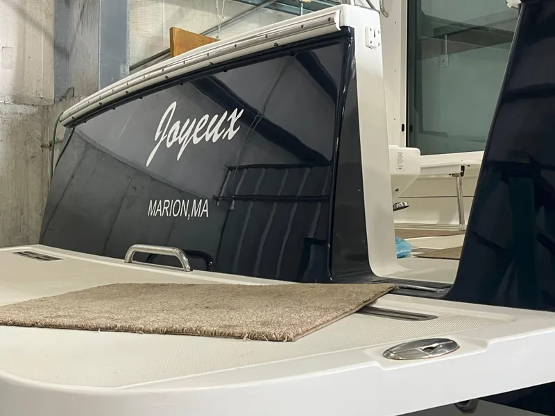 Slide: The Image of 2014 Back Cove 34 Hard Top boat with "Joyeux" name, docked in Marion, MA. - 13