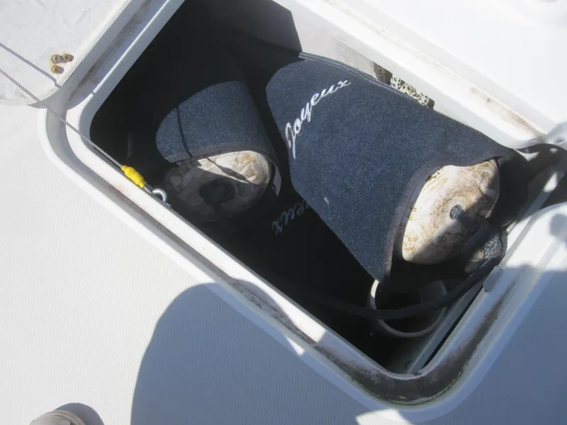Slide: The Image of Storage compartment on 2014 Back Cove 34 Hard Top boat with fenders. - 15