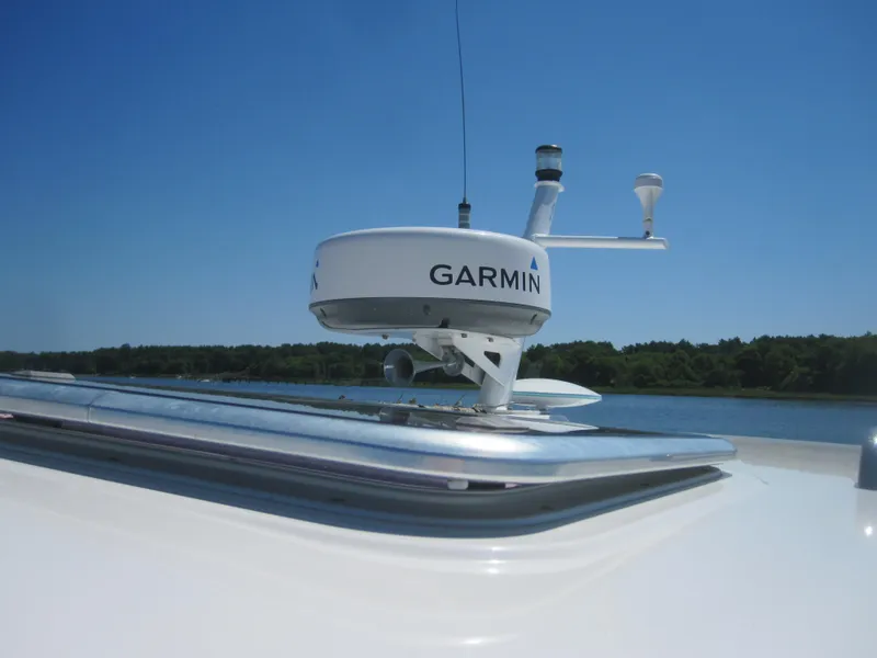 Slide: The Image of Garmin radar on 2014 Back Cove 34 Hard Top boat under clear blue sky. - 19