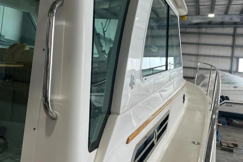 Slide: The Image of 2014 Back Cove 34 Hard Top/Hard Back boat in a storage facility. - 21