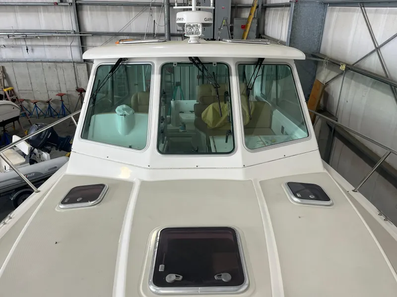 Slide: The Image of 2014 Back Cove 34 Hard Top boat in a storage facility. - 23