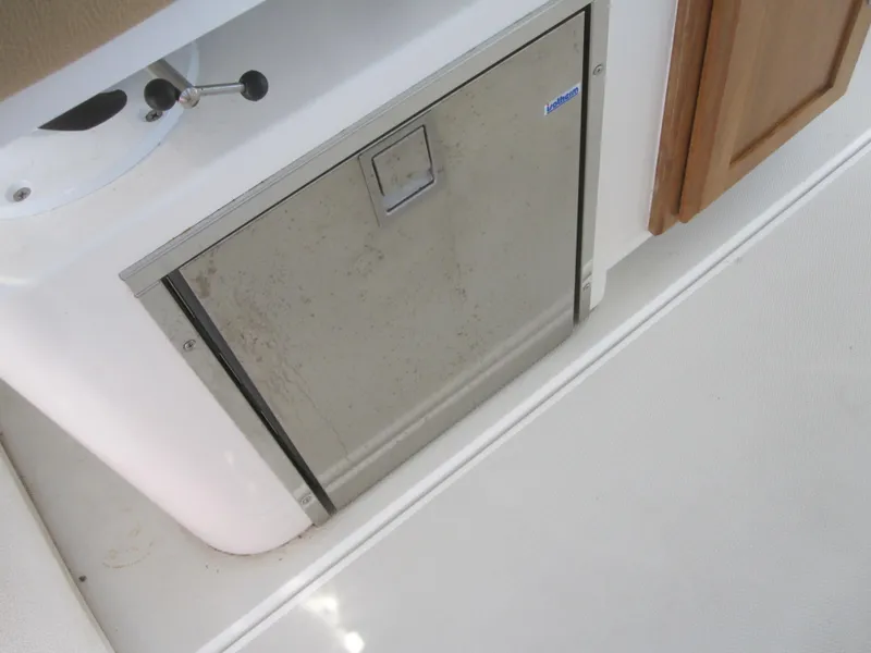 Slide: The Image of 2014 Back Cove 34 Hard Top interior with stainless steel appliance. - 43