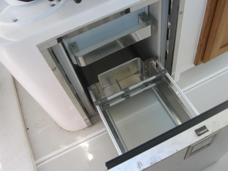 Slide: The Image of Open storage compartment on 2014 Back Cove 34 Hard Top/Hard Back boat. - 44