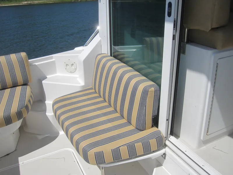 Slide: The Image of Striped seating on 2014 Back Cove 34 Hard Top boat, near water. - 50