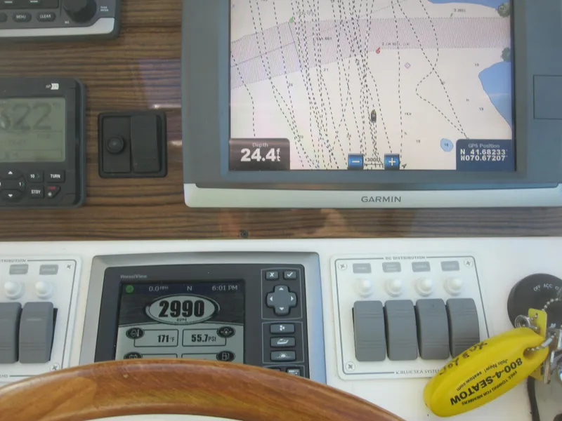 Slide: The Image of Boat navigation dashboard with Garmin GPS, Back Cove 34 Hard Top, 2014 model. - 54
