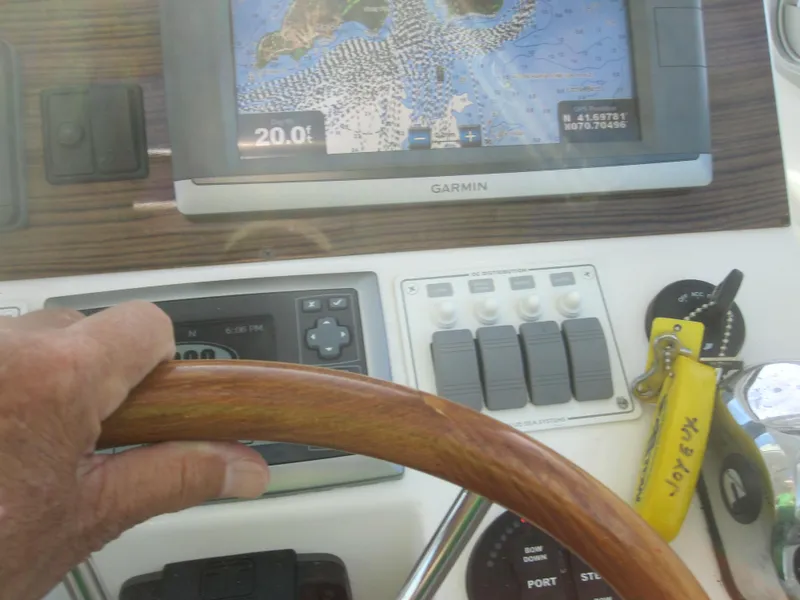 Slide: The Image of Hand steering 2014 Back Cove 34 boat with Garmin navigation display. - 55