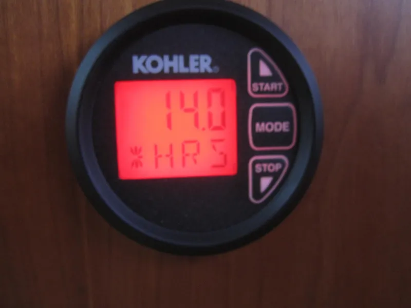 Slide: The Image of Kohler hour meter displaying 14.0 hours on a 2014 Back Cove 34 Hard Top/Hard Back. - 56