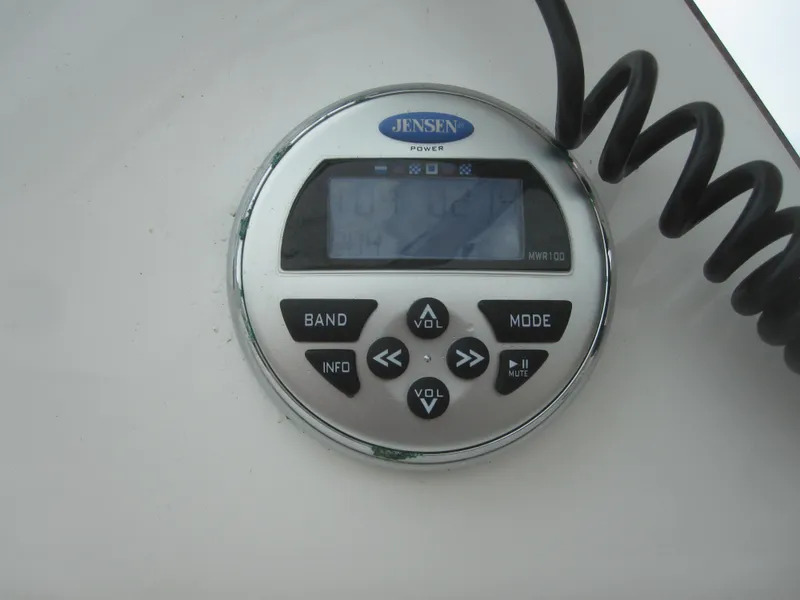 Slide: The Image of Jensen stereo control panel on 2014 Back Cove 34 Hard Top. - 57