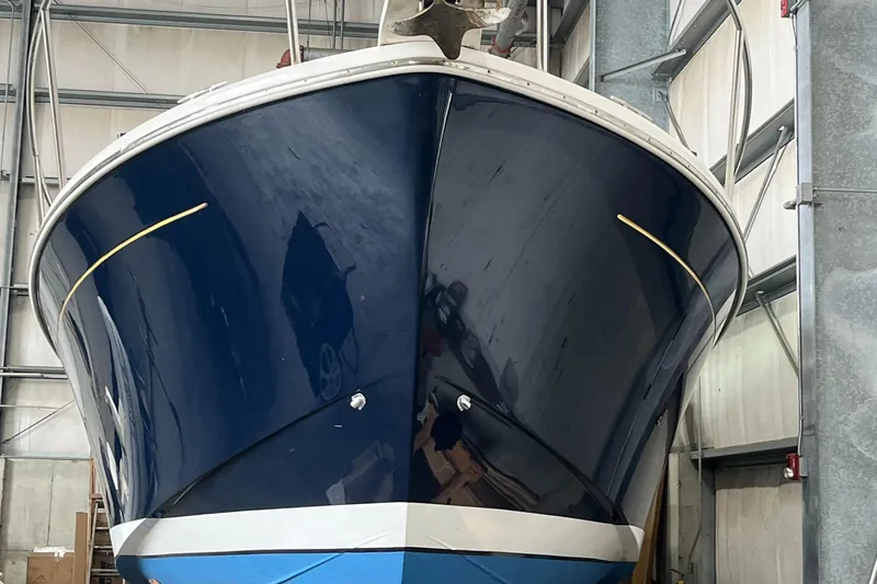 Slide: The Image of 2014 Back Cove 34 Hard Top/Hard Back boat in storage, front view. - 9