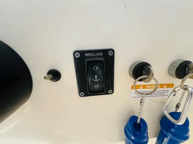 Slide: The Image of Windlass control panel on 2006 Carolina Classic 28 boat dashboard. - 11