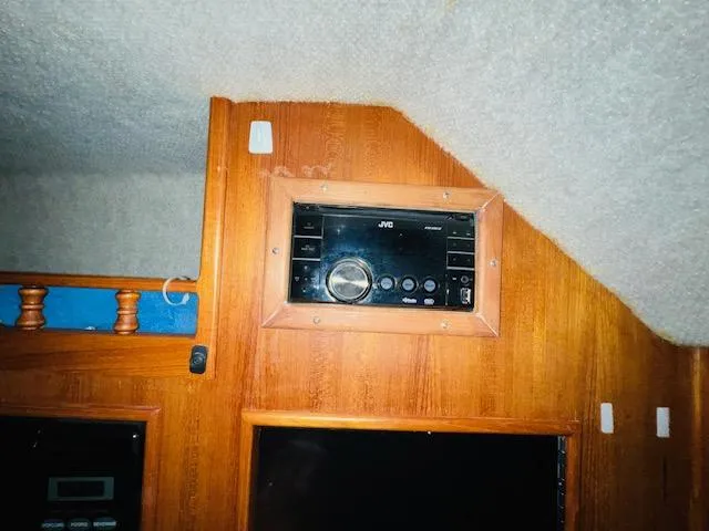 Slide: The Image of 2006 Carolina Classic 28 cabin interior with JVC stereo system. - 16