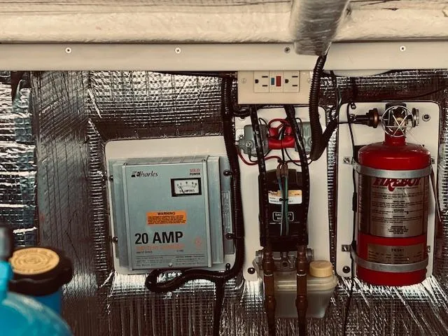Slide: The Image of Electrical panel and fire extinguisher in 2006 Carolina Classic 28 boat. - 19